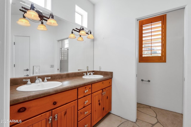9980 E Charter Oak Rd, Scottsdale, AZ 85260 - bathroom with an inviting chandelier, tile patterned floors, and vanity
