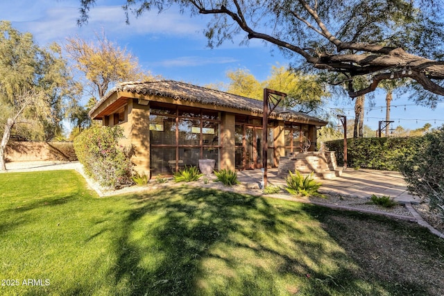 9980 E Charter Oak Rd, Scottsdale, AZ 85260 - back of house with a lawn