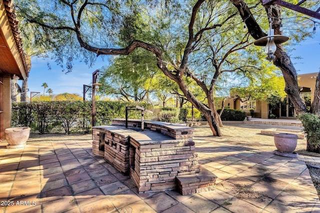 9980 E Charter Oak Rd, Scottsdale, AZ 85260 - view of patio with an outdoor kitchen