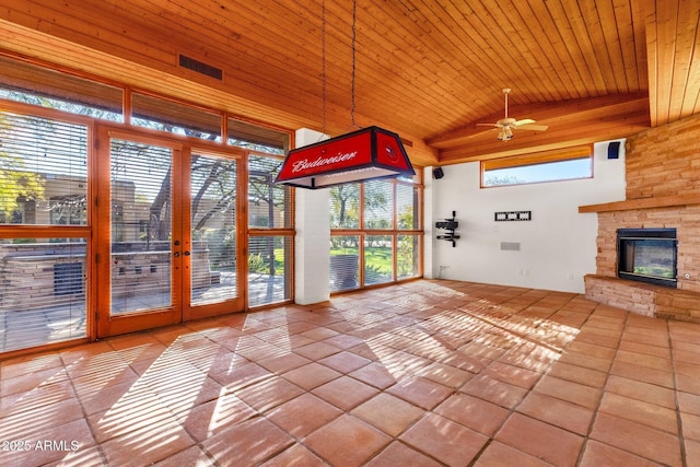 9980 E Charter Oak Rd, Scottsdale, AZ 85260 - unfurnished sunroom with wood ceiling, ceiling fan, lofted ceiling, and a stone fireplace