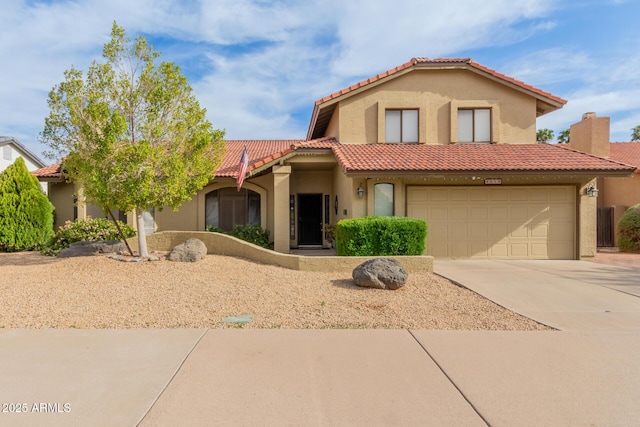 mediterranean / spanish-style home with stucco siding, a chimney, driveway, an attached garage, and a tile roof