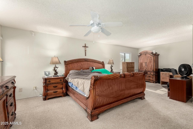 bedroom with light colored carpet, a textured ceiling, and ceiling fan