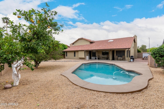 view of swimming pool featuring a fenced in pool and a patio area