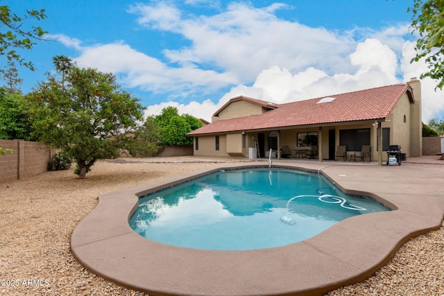 view of pool featuring a grill, a fenced in pool, a patio area, and a fenced backyard
