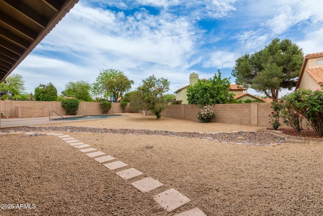 view of yard with a patio area, a fenced backyard, and a fenced in pool