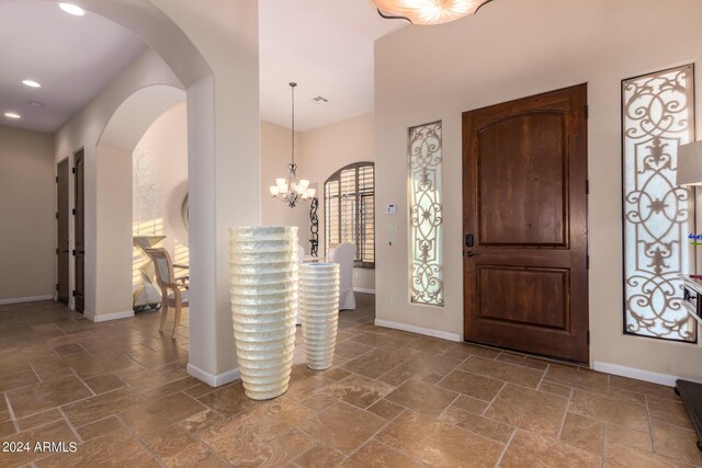 entrance foyer featuring a chandelier