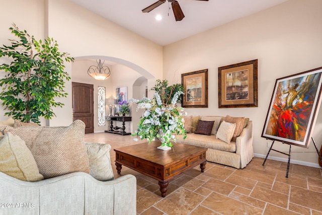 living room featuring lofted ceiling and ceiling fan