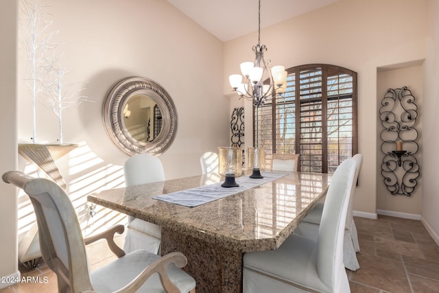 dining area featuring a notable chandelier