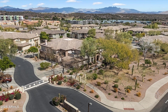 birds eye view of property with a mountain view and a residential view