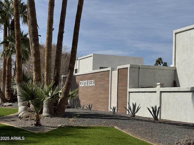 exterior space with fence and stucco siding