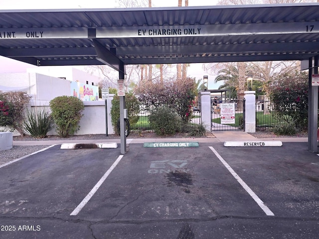 covered parking lot with fence