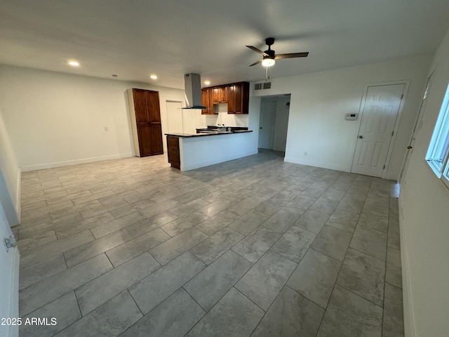 unfurnished living room featuring visible vents, recessed lighting, baseboards, and a ceiling fan