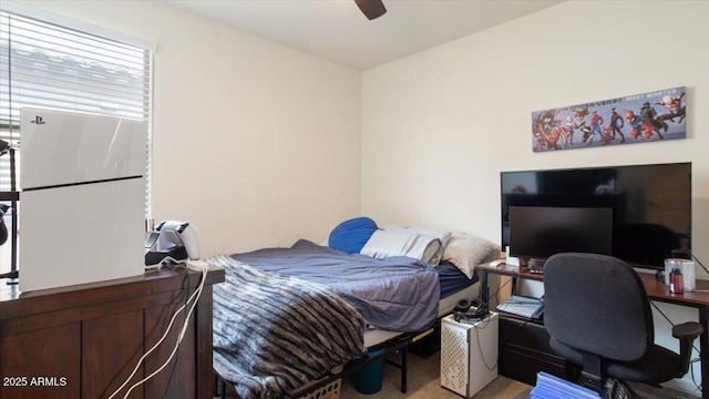 carpeted bedroom with a ceiling fan