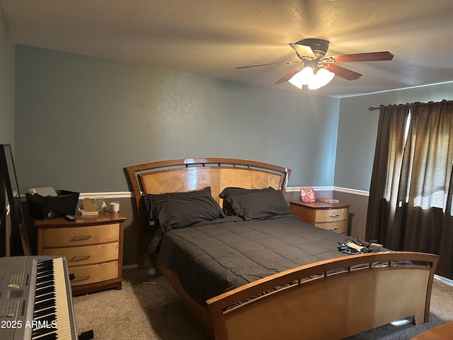 bedroom with ceiling fan and light colored carpet