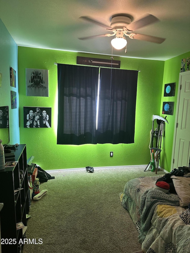 bedroom featuring ceiling fan and carpet floors