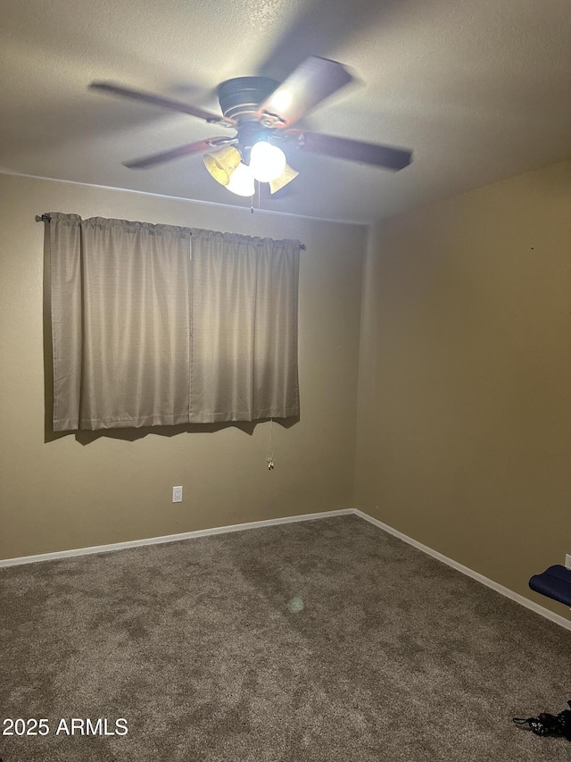 empty room with carpet and ceiling fan