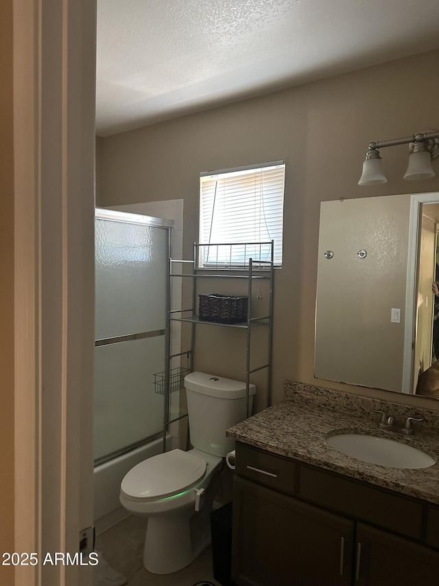 full bathroom featuring vanity, toilet, and enclosed tub / shower combo