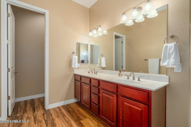 bathroom featuring vanity and hardwood / wood-style floors