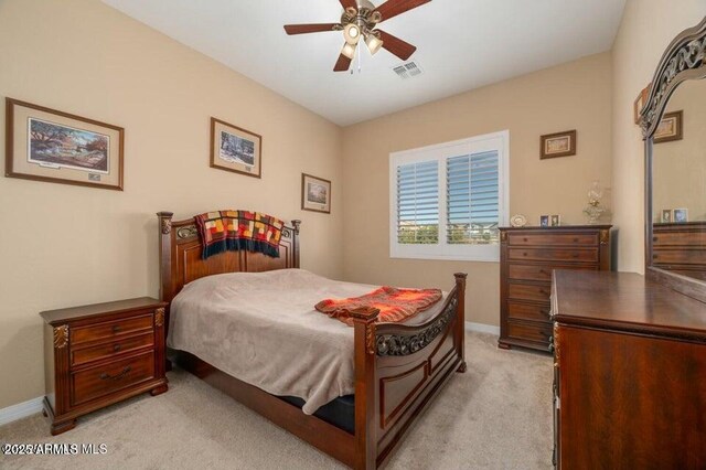 bedroom featuring light colored carpet and ceiling fan