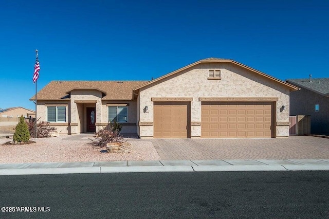 ranch-style home with a garage