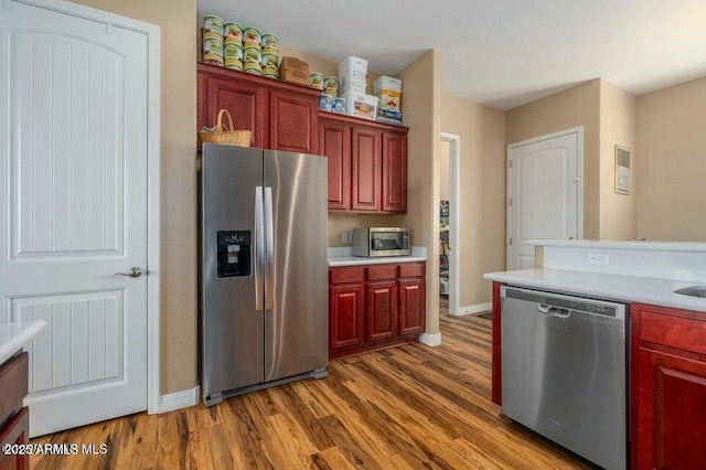 kitchen featuring appliances with stainless steel finishes and light wood-type flooring