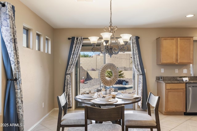 tiled dining area featuring a notable chandelier