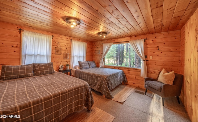 carpeted bedroom featuring wooden ceiling and wood walls