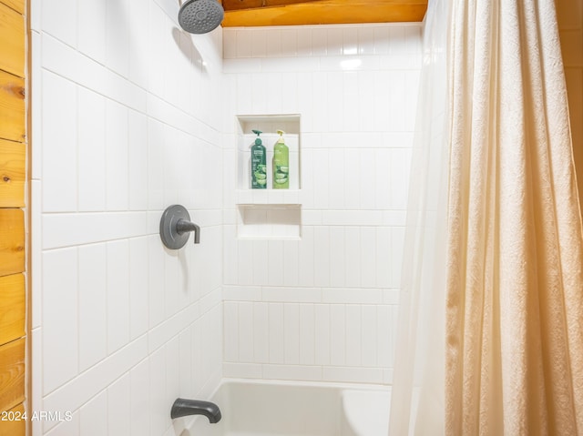 bathroom with shower / bath combination with curtain