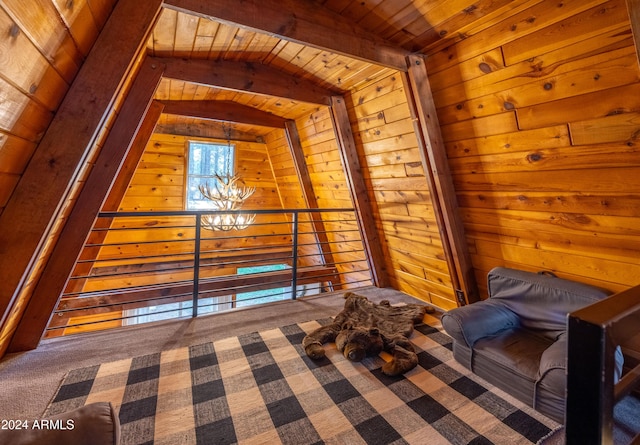 unfurnished bedroom featuring a notable chandelier, wooden walls, carpet flooring, wood ceiling, and beamed ceiling