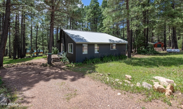 view of side of home featuring metal roof