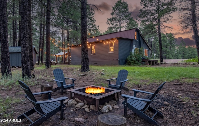 exterior space with a fire pit