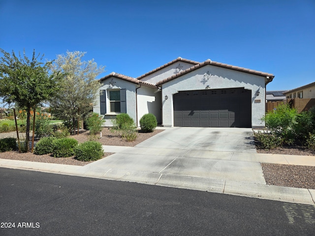 mediterranean / spanish-style home featuring a garage