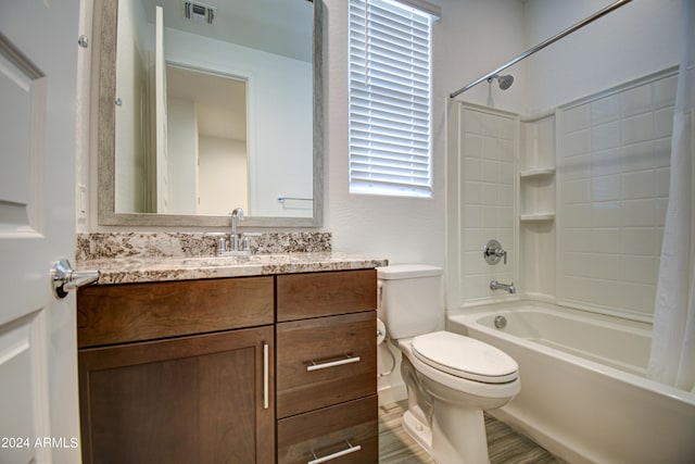 full bathroom featuring shower / bath combination with curtain, vanity, and toilet