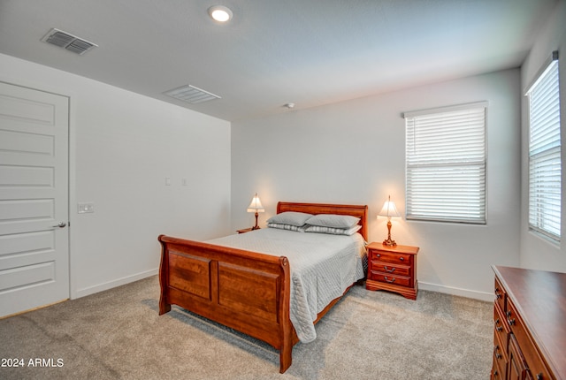 bedroom with light carpet