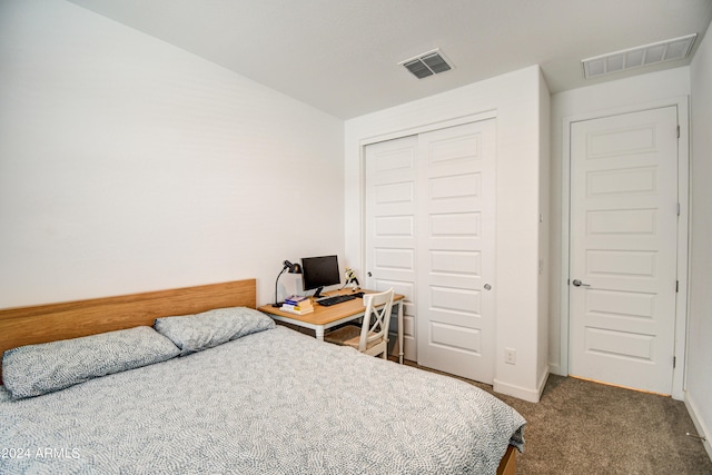 bedroom with carpet and a closet