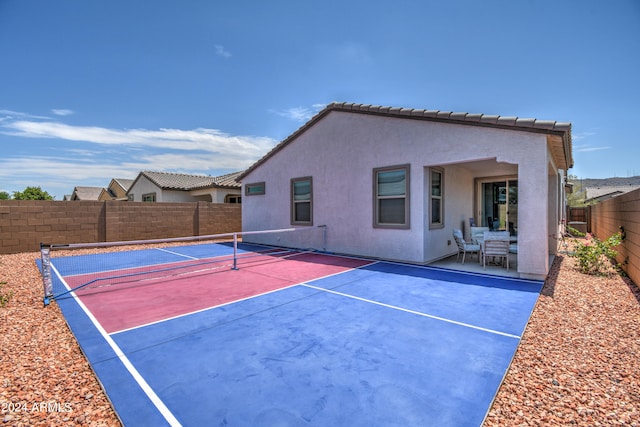 exterior space featuring tennis court