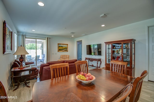 dining space featuring light wood-type flooring