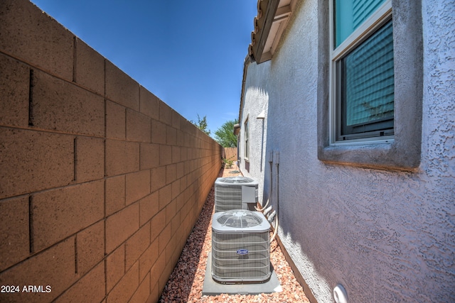 view of side of property with central AC unit