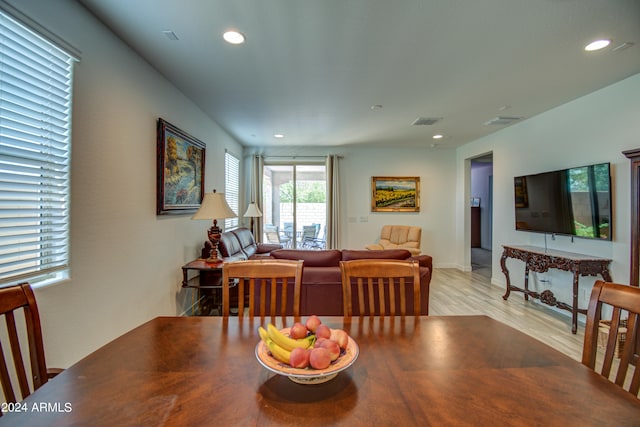 dining area with light hardwood / wood-style flooring