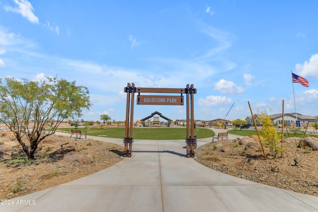 view of property's community with a lawn