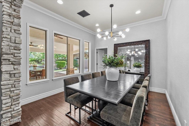 dining room with crown molding, baseboards, visible vents, and a chandelier
