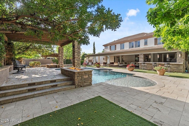 pool featuring a patio and outdoor lounge area
