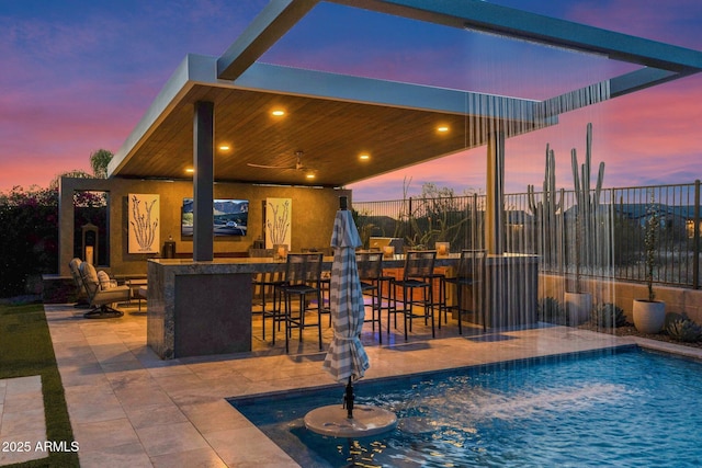 view of pool with fence and a patio area