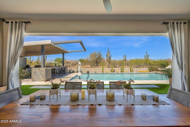 swimming pool featuring a patio and fence