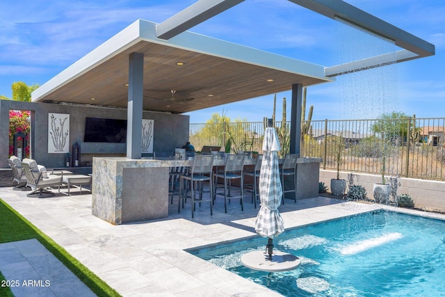 view of pool with fence, a patio, and a ceiling fan
