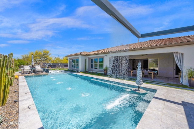 outdoor pool with a patio area