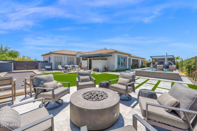 view of patio featuring an outdoor living space with a fire pit, an outdoor pool, and a gate