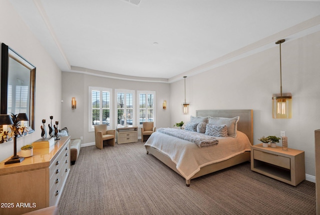 bedroom with carpet floors and baseboards