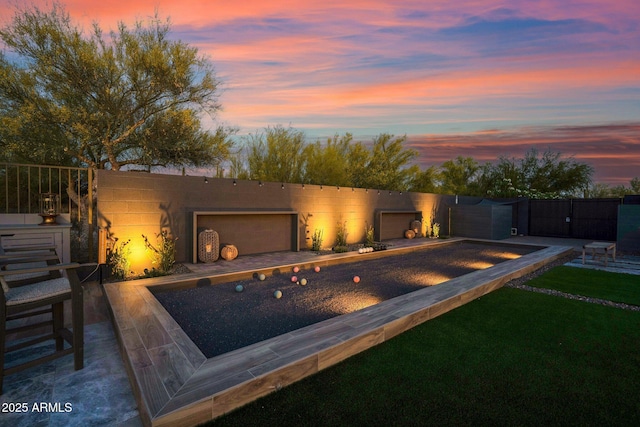 view of pool at dusk