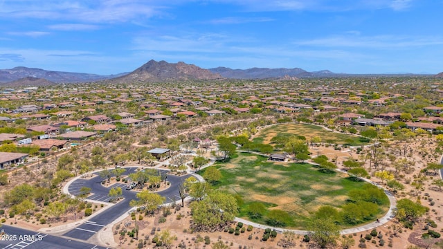 aerial view of property's location featuring mountains and nearby suburban area